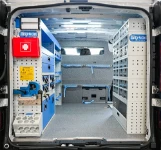 Allestimento con cassettiere in acciaio e trasparenti e accessori per Talento